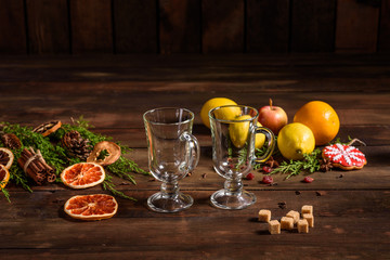 Christmas hot mulled wine with cinnamon cardamom and anise on wooden background