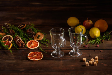 Christmas hot mulled wine with cinnamon cardamom and anise on wooden background