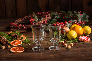 Fototapeta na wymiar Christmas hot mulled wine with cinnamon cardamom and anise on wooden background