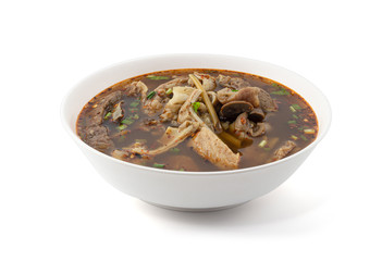 Thai Cuisine and Food, Delicious Thai Clear Spicy Hot and Sour Soup with Beef Entrails Isolated on White Background.