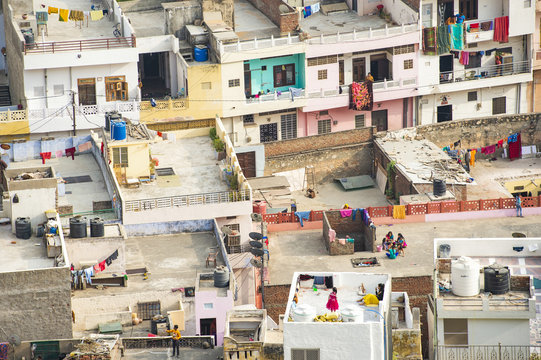 View from above, aerial view of some people on the rooftops of some houses in Jaipur. Jaipur is the capital and the largest city of the Indian state of Rajasthan, India.