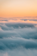 View of marine layer low clouds over Los Angeles at sunset, from Mount Wilson, in Angeles National Forest, California