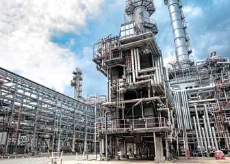Oil and gas industrial,Oil refinery plant form industry,Refinery factory oil storage tank and pipeline steel with sunset and cloudy sky background,Thailand