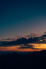 Crescent moon in the sky at sunset, seen from Griffith Park, in Los Angeles, California