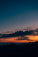 Crescent moon in the sky at sunset, seen from Griffith Park, in Los Angeles, California