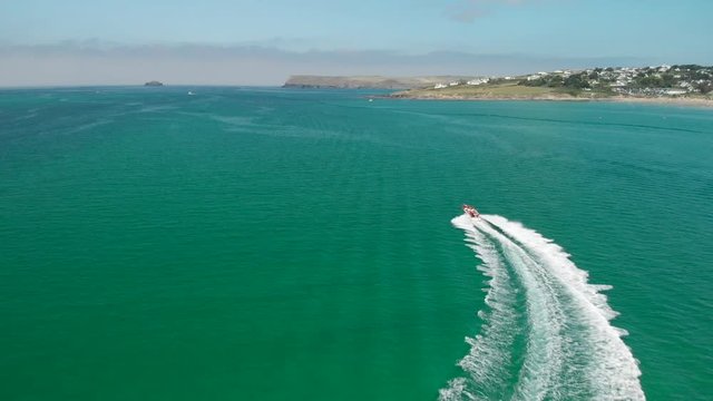 Version One. Aerial Follow Shot of Speedboat near Daymer Bay in Cornwall, England.