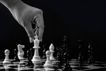 Chess with games of business. Businessman holding leader for fight.