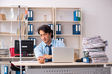 Young male employee in blood transfusion concept