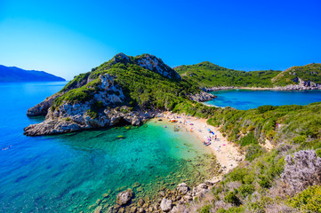 Porto Timoni beach at Afionas is a paradise double beach with crystal clear azure water in Corfu,...