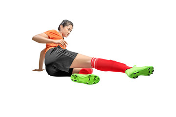 Asian football player woman on sliding tackle position