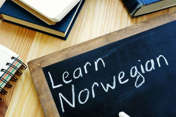 Learn Norwegian written on the blackboard.