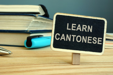 Learn Cantonese language concept. Book and notebooks.