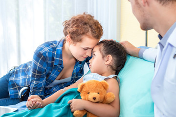 Fototapeta premium Pediatrician (doctor),mother reassuring and discussing her daughter. Patient girl sad on bedroom hospital.