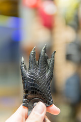 Crocodile leg, souvenir for tourist , selective focus.