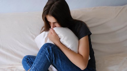 Desperate lady suffering anxiety attack at sitting alone at home, feeling helpless, heartbroken frustrated lonely girl having psychological trauma problem troubled with pregnancy