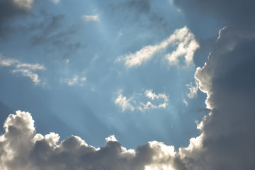 Blue sky breaking through dramatic cloudscape.