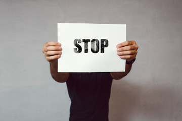 Man holding paper sign