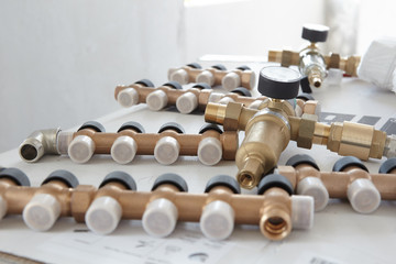 Elements of water conduit and manometers in room