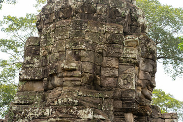 Fototapeta na wymiar Stone Faces from Bayon Temple in Angkor Thom, near Siem Reap, Cambodia. 