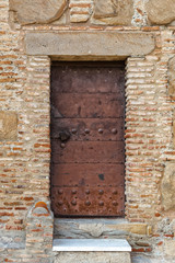 Fototapeta na wymiar Antique metal door with rivets