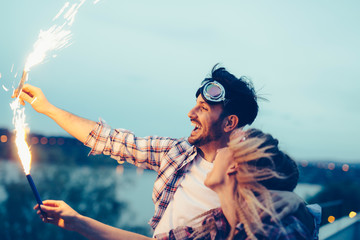 Young couple sparkler celebration happiness togetherness concept
