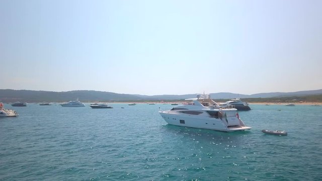 jet set near saint tropez, cannes, south of france, view from a boat with many mega yachts in the medditeranean sea summer vacation spot