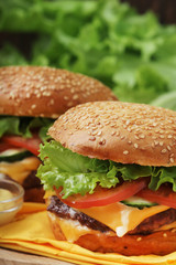 Two fresh hamburgers with vegetables