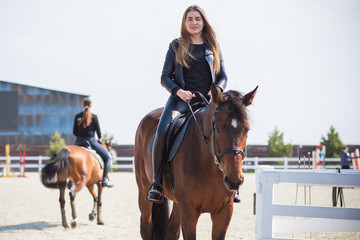 Hobby concept, woman with a horse on a horse farm. Human and animals friendship 