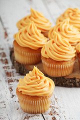 Cupcakes with orange icing on top