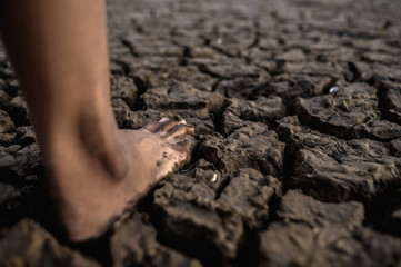 Children are walking barefoot on mud,selective focus