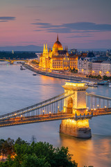 Naklejka na ściany i meble Budapest, Hungary. Aerial cityscape image of Budapest with Szechenyi Chain Bridge and parliament building during summer sunset.