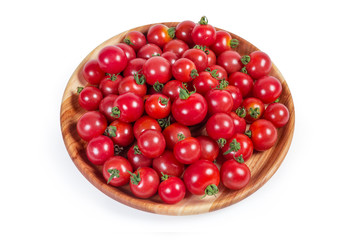 Cherry tomatoes on the wooden dish on a white background