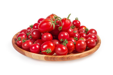 Cherry tomatoes on the wooden plate on a white background