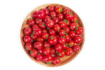 Top view of cherry tomatoes on the wooden dish