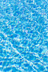 Ripple Water in swimming pool with sun reflection