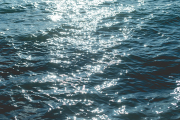 Bokeh caused by sunlight affects the sea water.