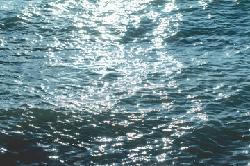 Bokeh caused by sunlight affects the sea water.
