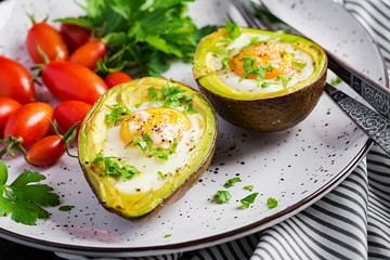 Avocado baked with egg and fresh salad. Vegetarian dish. Ketogenic diet. Keto food