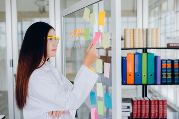 Positive delighted female scientist doing experiment