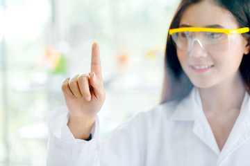 Woman scientist Is making a hand pointing to the mirror