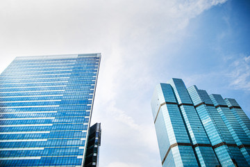 Fototapeta na wymiar Bottom view of modern skyscrapers in business district