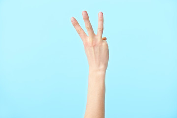 human hand showing number three