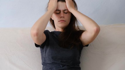 Frustrated female having emotional problems, fears, worried and hopeless, upset nervous teen girl in trouble having problem regret unwanted pregnancy need psychological help sitting alone at home