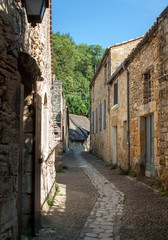  Typical French townscape with ancient housest and cobblestone street in the traditional town Beynac-et-Cazenac, France