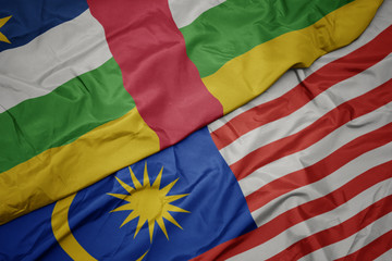 waving colorful flag of malaysia and national flag of central african republic.