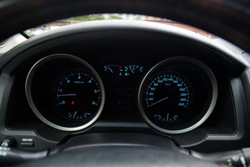 View to the interior of car with dashboard, speedometer, tachometer after cleaning before sale on parking