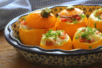 Round zucchini stuffed with rice and mozzarella