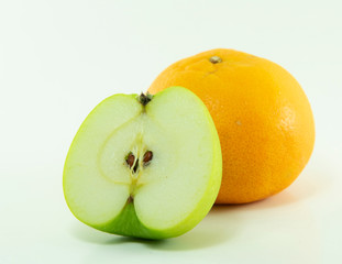 apple slice and orange isolated on white