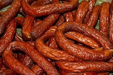 Close-up of a bundle of smoked and dried sausages.