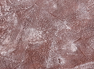 Dark texture of old shabby stucco or concrete. Rough weathered red-brown texture, background,...